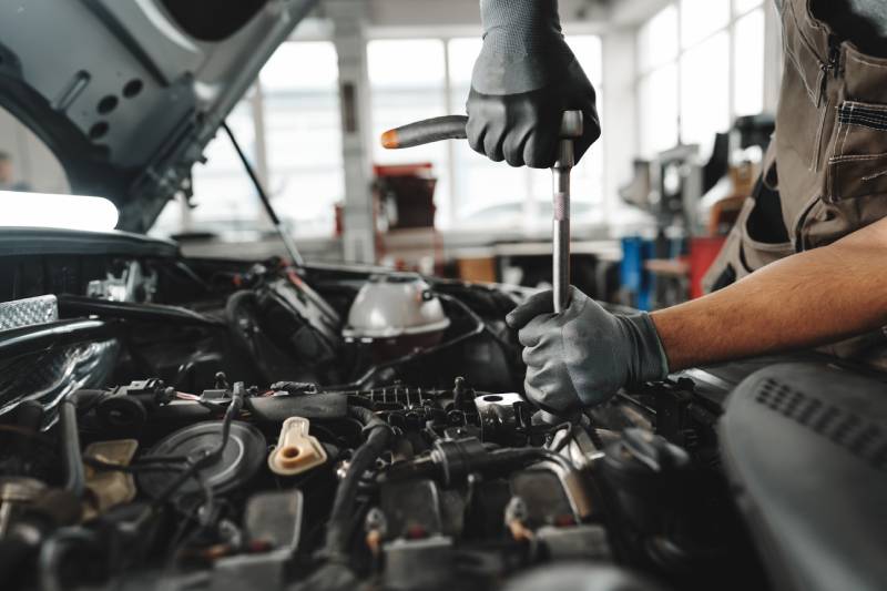 close-up-of-mechanic-s-hands-repairing-car-engine-2026-01-08-05-20-37-utc (1)