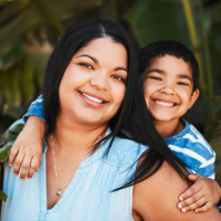 smiling-woman-with-dark-hair-poses-with-child-2026-03-25-04-22-33-utc (1)